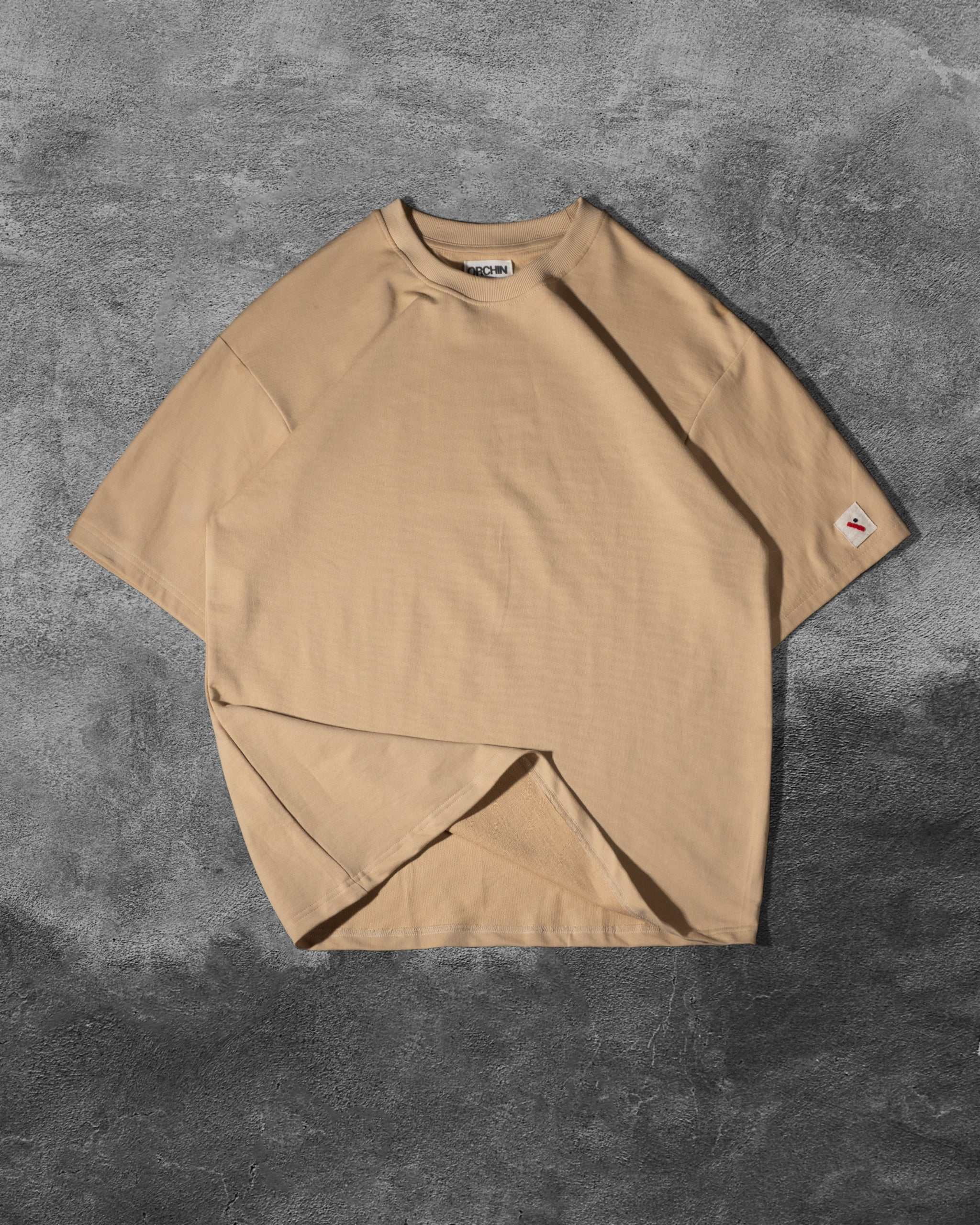 Oversized Cotton Basics beige cotton terry t-shirt with relaxed fit and subtle embroidered branding