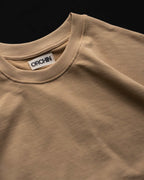 Oversized Cotton Basics Beige oversized cotton t-shirt with relaxed fit and subtle embroidery on edge