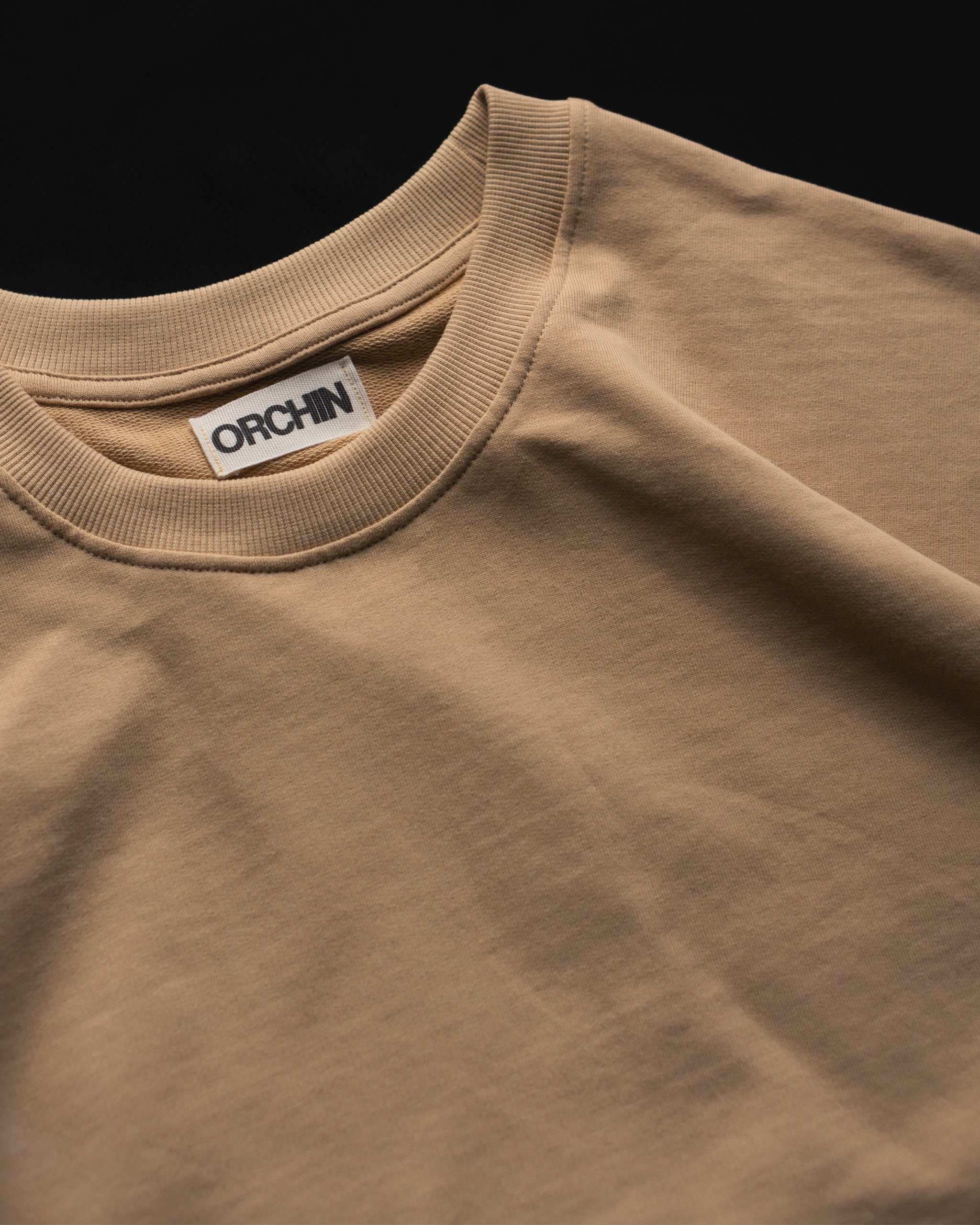 Oversized Cotton Basics Beige oversized cotton t-shirt with relaxed fit and subtle embroidery on edge