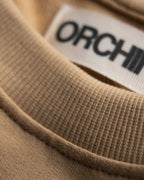 Oversized Cotton Basics Beige oversized cotton t-shirt with relaxed fit and subtle embroidery on edge