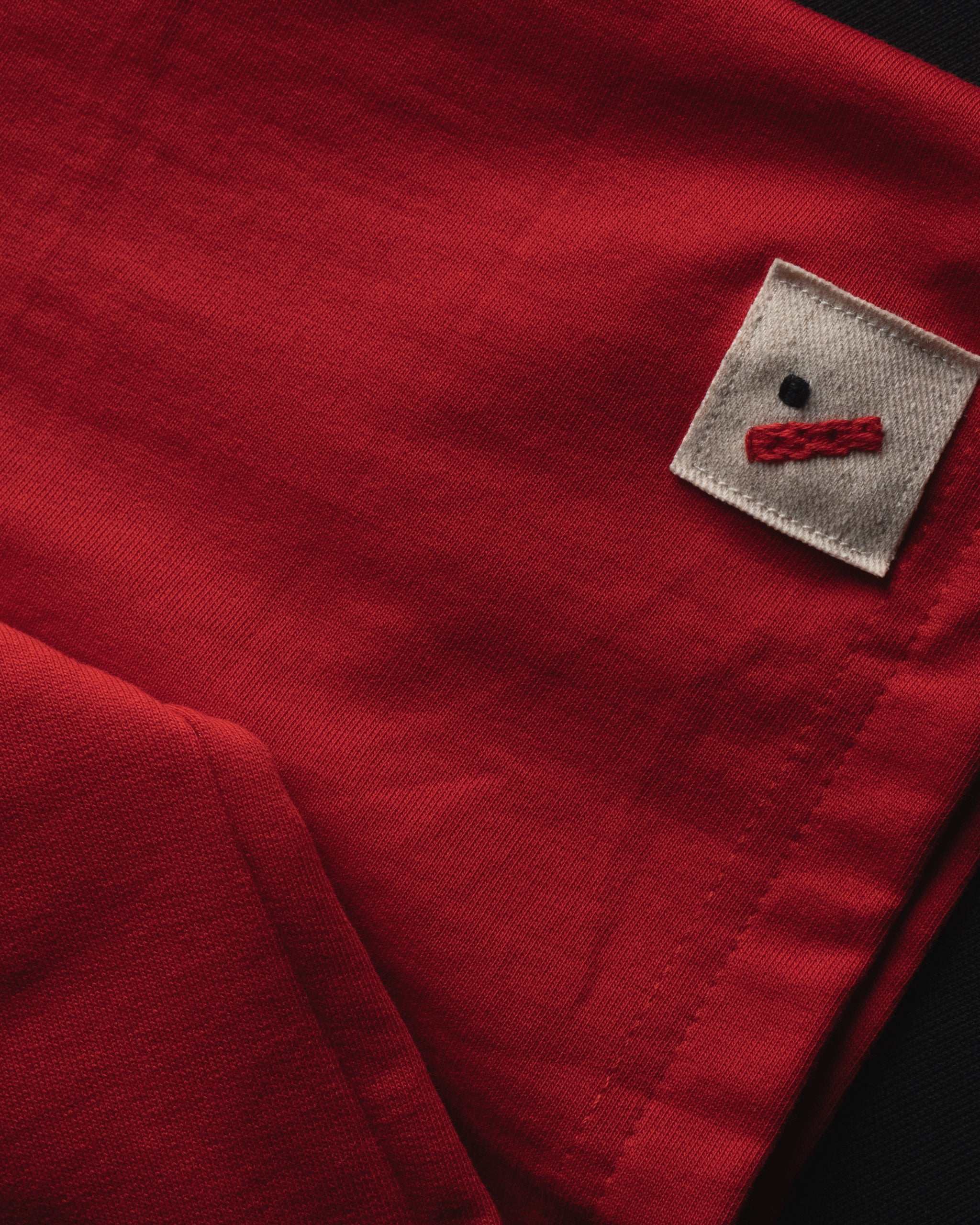 Red oversized cotton basics t-shirt with relaxed fit and subtle embroidery